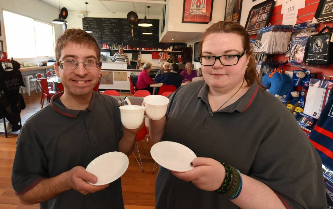 Pavel Anichkin and Stephanie Bailey are two of eight staff members currently working towards a certificate I in hospitality at Cafe Next Door. Picture: Paul Scambler 