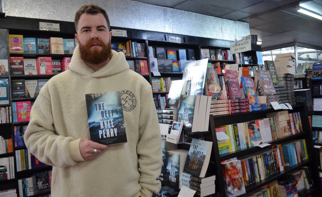 BIG DAY: Tasmanian author Kyle Perry signed copies of his latest book The Deep at Petrarch's in Launceston on Wednesday. Picture: Jessica Willard 