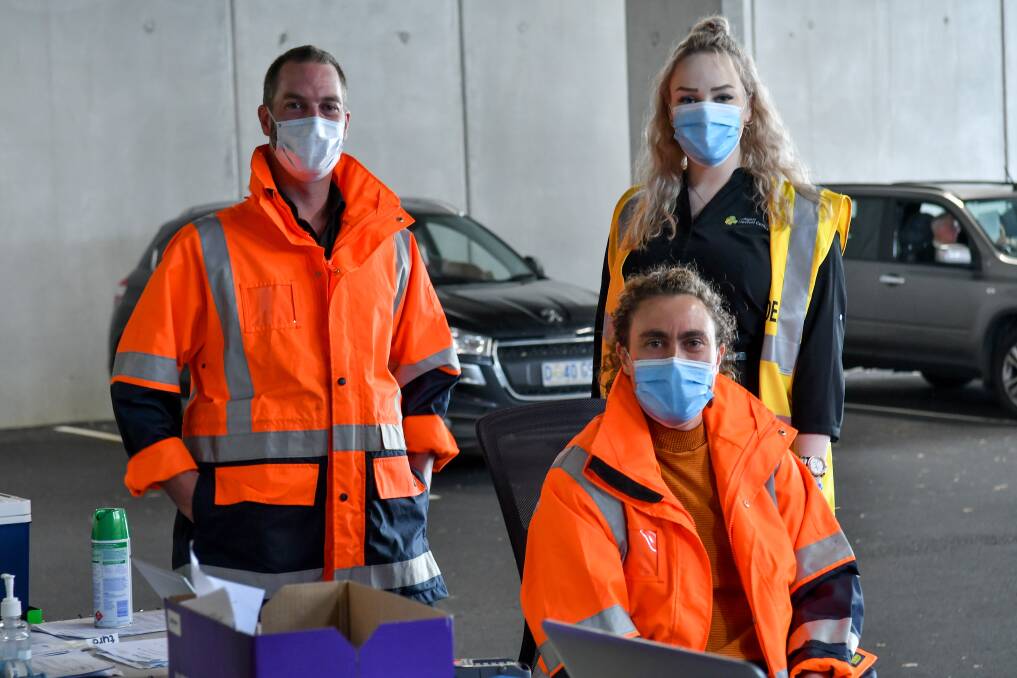 SERVICE: Launceston Medical Centre's enrolled nurse Duncan Woodroffe, assistant Cloe Saunders and Dr Alice Downie at the drive-in flu clinic. Picture: Scott Gelston