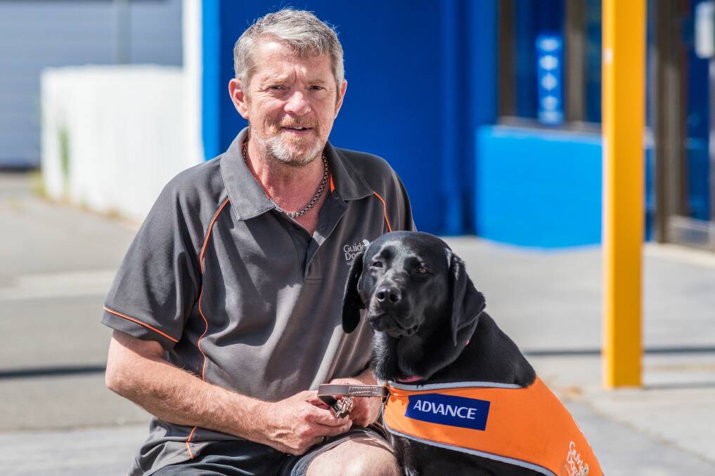 TEAM: Guide Dogs Tasmania community engagement officer Paul Wyld with Northern ambassador Paris. 
Pictures: Phillip Biggs 