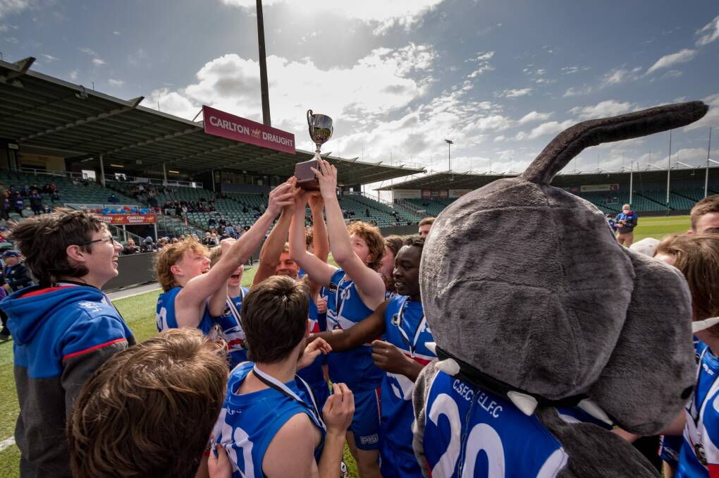 South Launceston players hold the cup aloft after claiming victory over Longford in the under 18 NTFA premier division grand final at UTAS Stadium. Picture: Phillip Biggs 