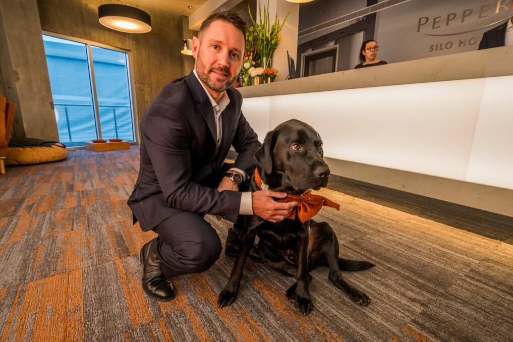 TEAM: Peppers Silo Hotel general manager Shannon Exelby with Archie the Silo Dog. Picture: Phillip Biggs 