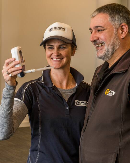 Healthy Tasmania Managing director Lucy Byrne and Mission to Quit participant and City Mission employee Nicky Gray. Picture: Phillip Biggs