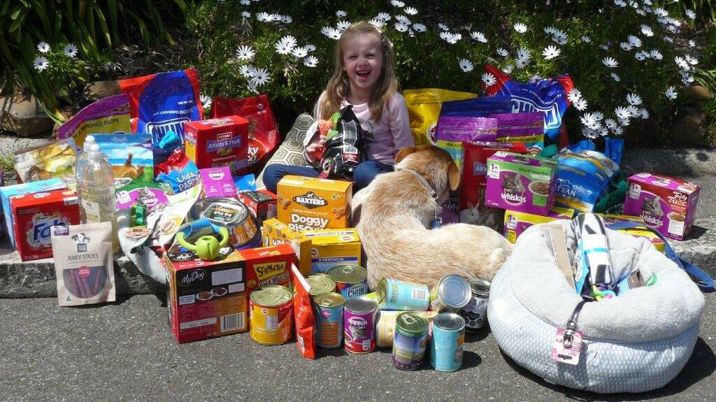 HAPPY: In lieu of birthday gifts, six-year-old Sophie Anthony asked her friends to donate animal products to the Launceston RSPCA Animal Care Centre. Picture: Supplied 