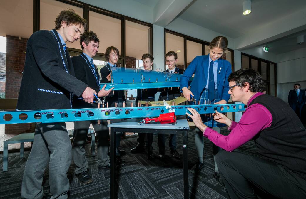Launceston Grammar students building an aeroplane: reporter: Jess Willard Nicole Patrick, and Dr Cameron Rogers at right, then from left to right, Sam Hillcoat, George Gray, Harry Swan, Guy Chilcott, Will Robertson Wednesday July 25 2018 picture: Phillip Biggs