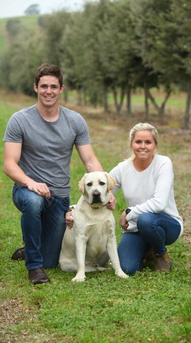 Siblings Henry and Anna Terry of Tasmanian Truffles at the Needles, with Doug the Labrador. Picture: Paul Scambler