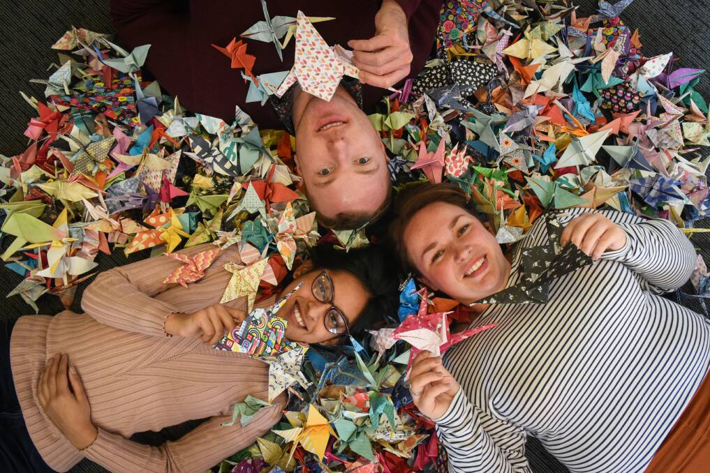 GOOD CAUSE: Cornerstone Youth Services clinicians Isha Verma, Liam Spicer and Danielle Jackson with their paper crane creations, ahead of International Overdose Awareness Day 2020. Picture: Paul Scambler