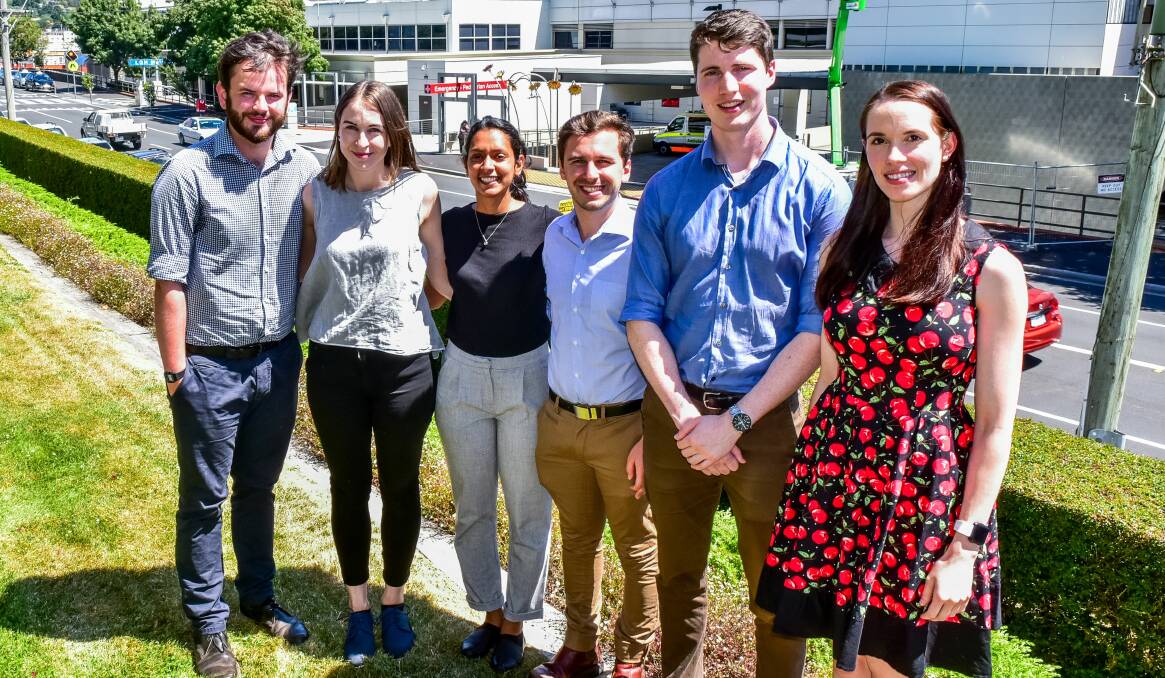 Excited: Medical interns and couples Duncan Galloway and Emily Mackrill, Mrunmayee Bhalerao and Nicholas Moutsatsos, and Kell Retchford and Emily Baines.  Picture: Neil Richardson  
