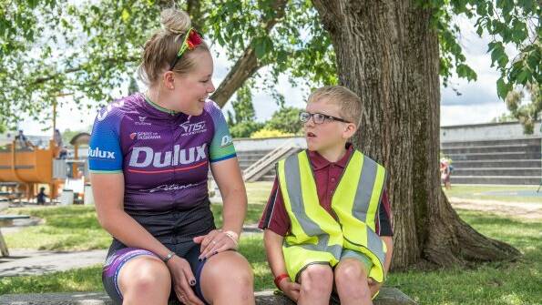 TIS cyclist Lauren Perry talks to Ravenswood Heights grade 2 student and volunteer Brodie Goymour ahead of Sally's Ride. Picture: Scott Gelston. 