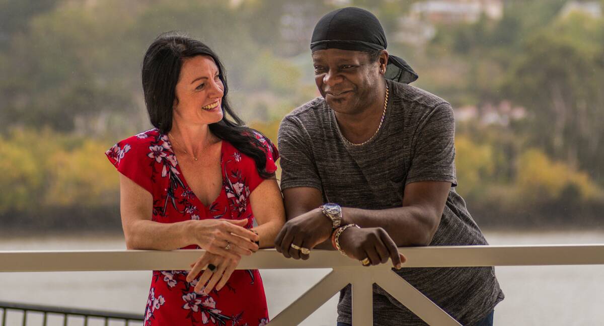 AWARENESS: Palliative Care Tasmania's community engagement manager Sharon King, with British comedian Stephen K Amos. Picture: Phillip Biggs 
