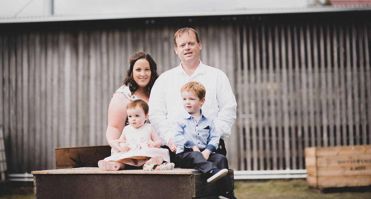 HARD TIMES: Kahlia and Adam Smith with their children Thea, 1 and Fletcher, 3, pictured a week before Mr Smith was hospitalised with bowel cancer. To donate to Aid for an Ambo visit gofundme.com. Picture: Zara Maree Photography