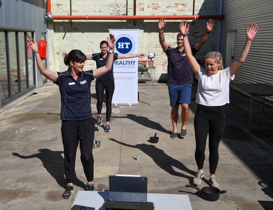 TEAM: Healthy Tasmania's Penny Terry, Lucy Byrne, Hayden Fox and dietitian Anna Terry during Monday's Facebook live exercise session. Picture: Neil Richardson