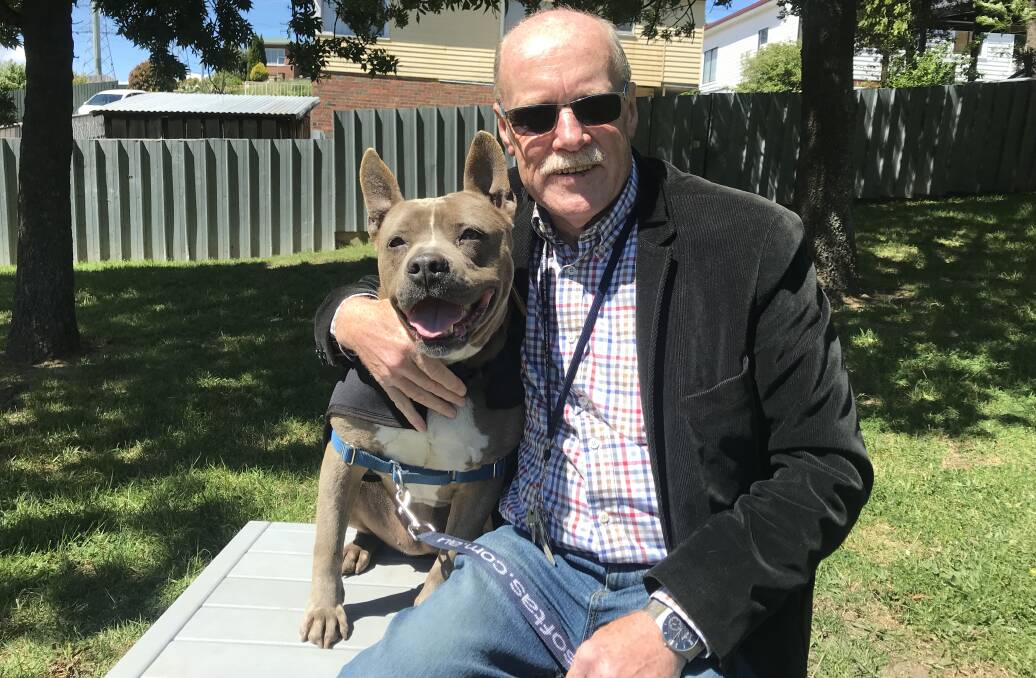 Dogs’ Homes of Tasmania chief executive Michael Sertori, with Roxy. Picture: Supplied 