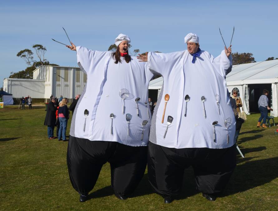 FUN TIMES: Jolly Giant Chefs Dijon and Ketchup make their way through the crowds during Sunday's Tassie Scallop Fiesta at Bridport. Picture: Jessica Willard 