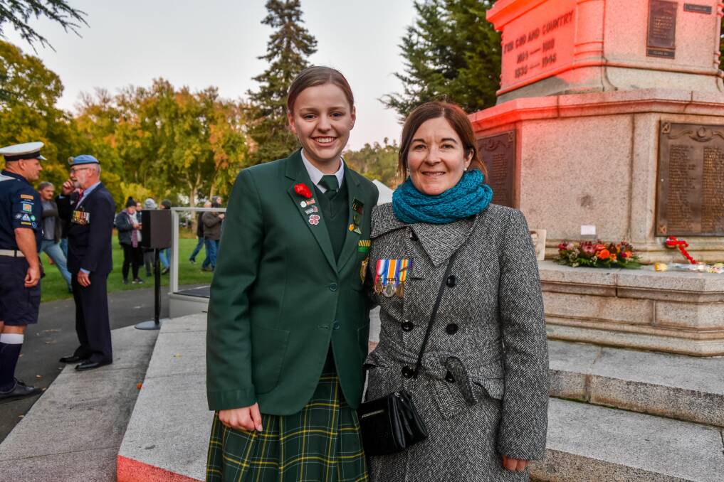 St Patricks College student Sasha Massey with Claire Wilson, of Legana, wearing the medals of her great-aunt Ethel who served in the Queen Alexandra Imperial Military Nursing Service during World War I. Picture: Neil Richardson 