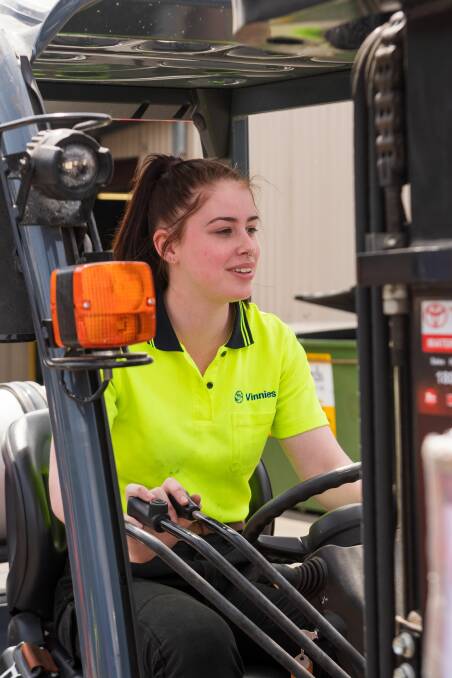 Driving a fork lift is one of the many skills Ms Blake has picked up through her work with Vinnies. 