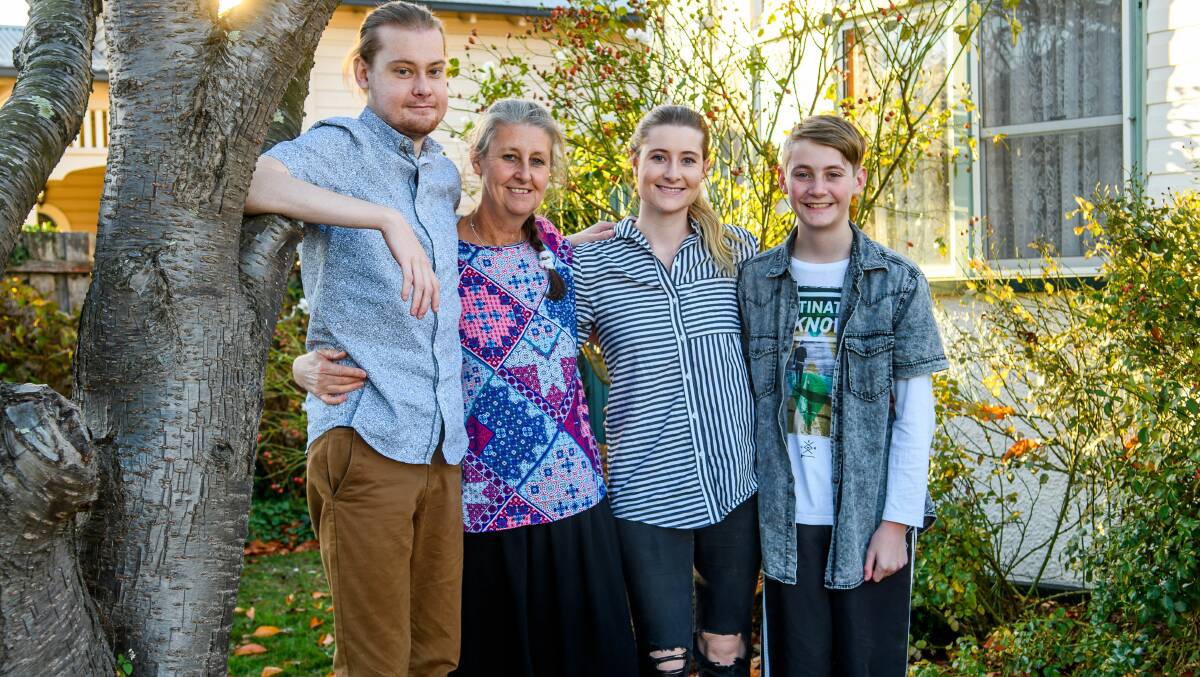 Joe Johnston with mother Jenny, sister Grace and brother Will. Picture: Scott Gelston