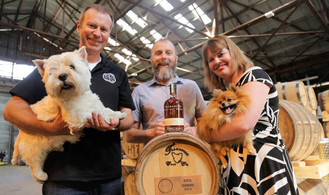 EVENT: Launceston Distillery's Chris Condon with Angus, Star Theatre co-owner Ben Davis and RSPCA Tasmania's Melanie Knight, with dog Chloe. Picture: Matt Dennien 