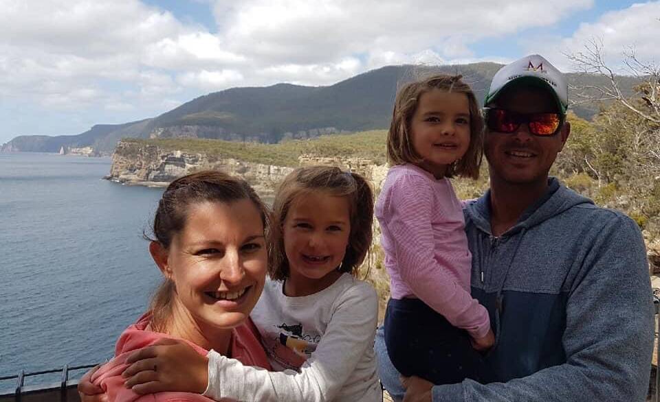 Greg Longmore, with wife Erin and their two young children. Picture: Supplied 