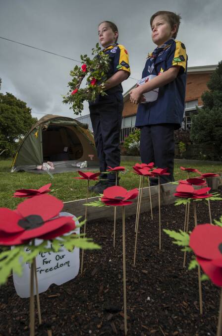 While unable to take part in this year's march of remembrance, school groups, Scouts and Girl Guides are still invited to lay wreaths this Anzac Day. Pictured during the 2020 commemorations, Summerhill cubs Petalynn and Robert Webb. Picture: File 
