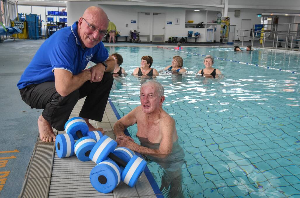 THERAPY: Joint movement leader Martin O’Toole with Kenneth Neville at Thursday's warm water therapy session at Launceston Aquatic Centre. Picture: Paul Scambler 