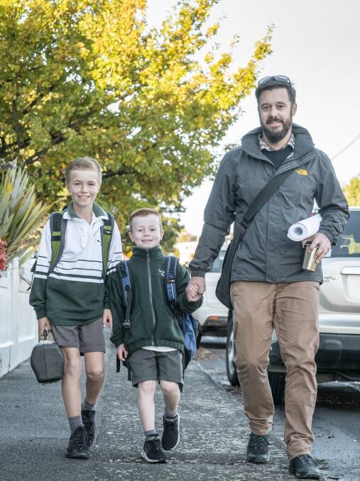 BIG STEP: East Launceston Primary School students Miles 9, and Fletcher, 6 with Mathew Green during Friday's walk. Picture: Craig George 