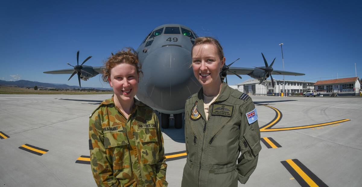 Cadet Phoebe Waugh, of Hobart, and FLTLT Nina Carpenter of the Royal Australian Air Force, with the Hercules. 
