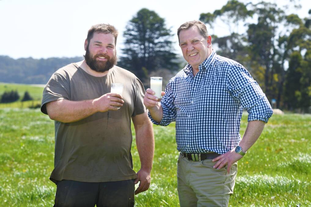 MILKING IT: Dairy farmer Simon Elphinstone and Gavin Pearce MP hope labelling laws can protect meat and dairy from plant-based "pretenders". Picture: Brodie Weeding