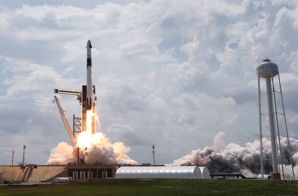 The SpaceX Falcon 9 rocket with the manned Crew Dragon spacecraft attached takes off from the Kennedy Space Centre in Cape Canaveral, Florida on Saturday, May 30 (local time). Photo: Joe Raedle/Getty Images