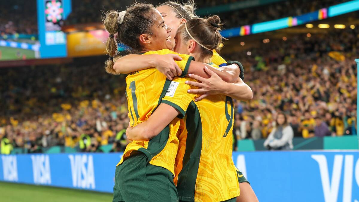 Matildas players Mary Fowler, Steph Catley (middle) and Caitlin Foord celebrate after Foord's goal in their 1-0 win over Denmark. Picture by Adam McLean.