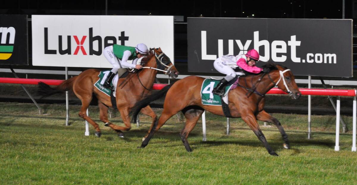SIX IN ROW: I'm Wesley, ridden by Raquel Clark, beats hot favourite Hellova Street in the $100,000 Conquering Stakes at Mowbray on Wednesday night. Picture: Greg Mansfield