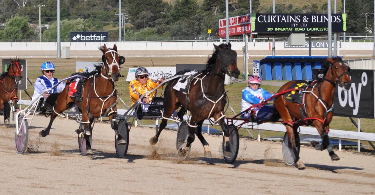 STARS IN ACTION: Grant Dixon wins a heat of the 2015 Australian Drivers Championship at Mowbray on Olivers Mate (centre) beating Gavin Lang (outside) and Lauren Tritton. Dixon went on to claim the title.