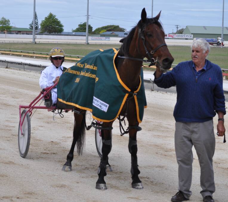 TREBLE: Track specialist Riverboat Jasper with driver Rohan Hillier and owner-trainer Wayne Campbell after his third NWTLHA Cup win at Devonport on Sunday. Picture: Greg Mansfield