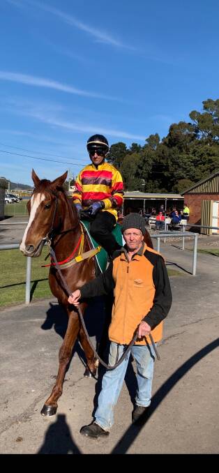 Trainer Bill Ryan leads Still A Star and jockey Brendon McCoull onto the track for a barrier trial at Spreyton on Tuesday.
