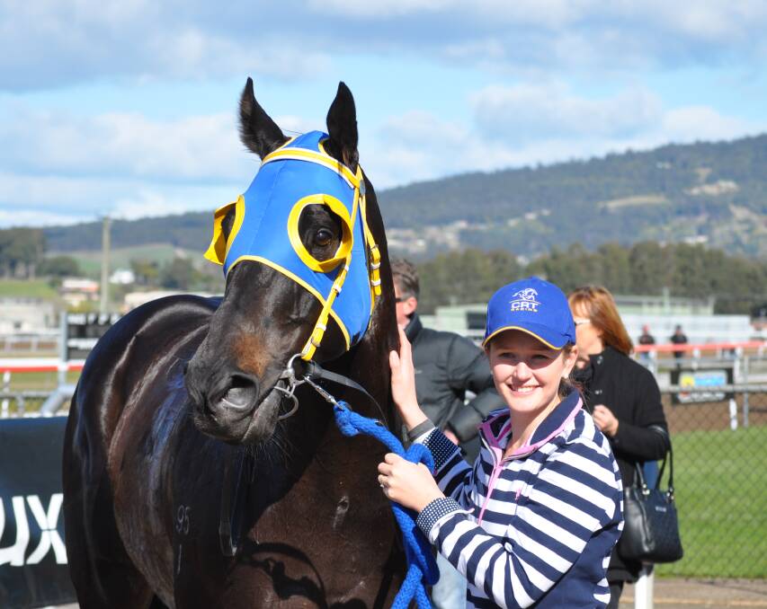 NEWCOMER: Former NSW and Queensland-based galloper Tammany Hall with strapper Beth Thompson after he won at his second Tasmanian start in Devonport on Sunday. Picture: Greg Mansfield
