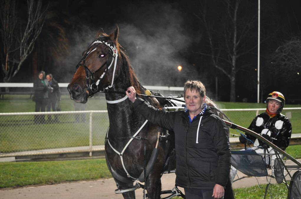 ALL STEAMED UP: John's Legacy with owner-trainer Cleone Hill and driver Jack Laugher after an emotional win at Mowbray on Sunday night.