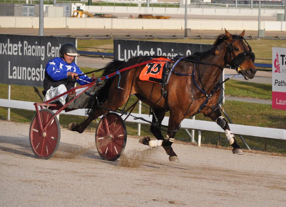 TOO GOOD: Scooterwillrev, driven by Rohan Hadley, thrashes his rivals in the Danbury Park Cup at Mowbray on Friday night to become the first horse for 44 years to win the race off 30m. Picture: Greg Mansfield