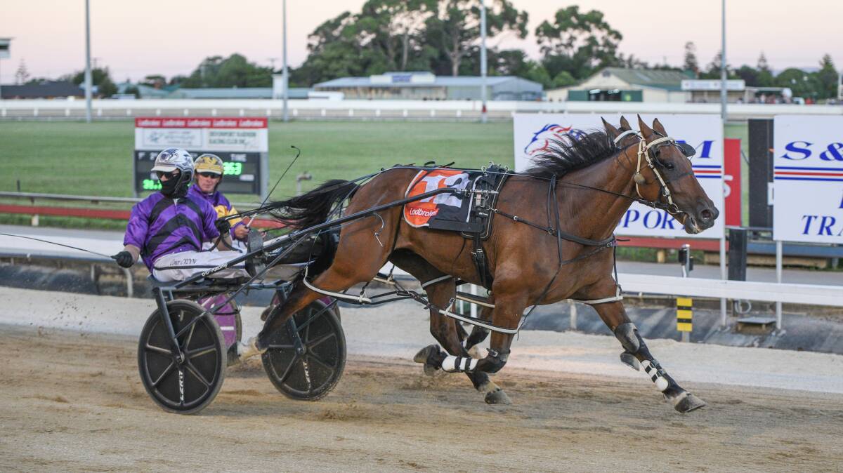 OVERDUE: Lip Reader, driven by Conor Crook, runs past stablemate Ryley Major to win the $40,000 Devonport Cup. Picture: Stacey Lear