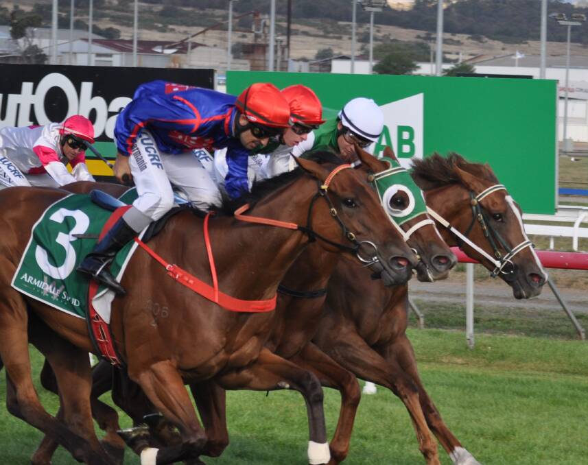 CLOSE: I Remember You (centre) and Life On The Wire (inside) are just edged out by Twitchy Frank in the Vamos Stakes at Mowbray on Cup Day. Picture: Greg Mansfield