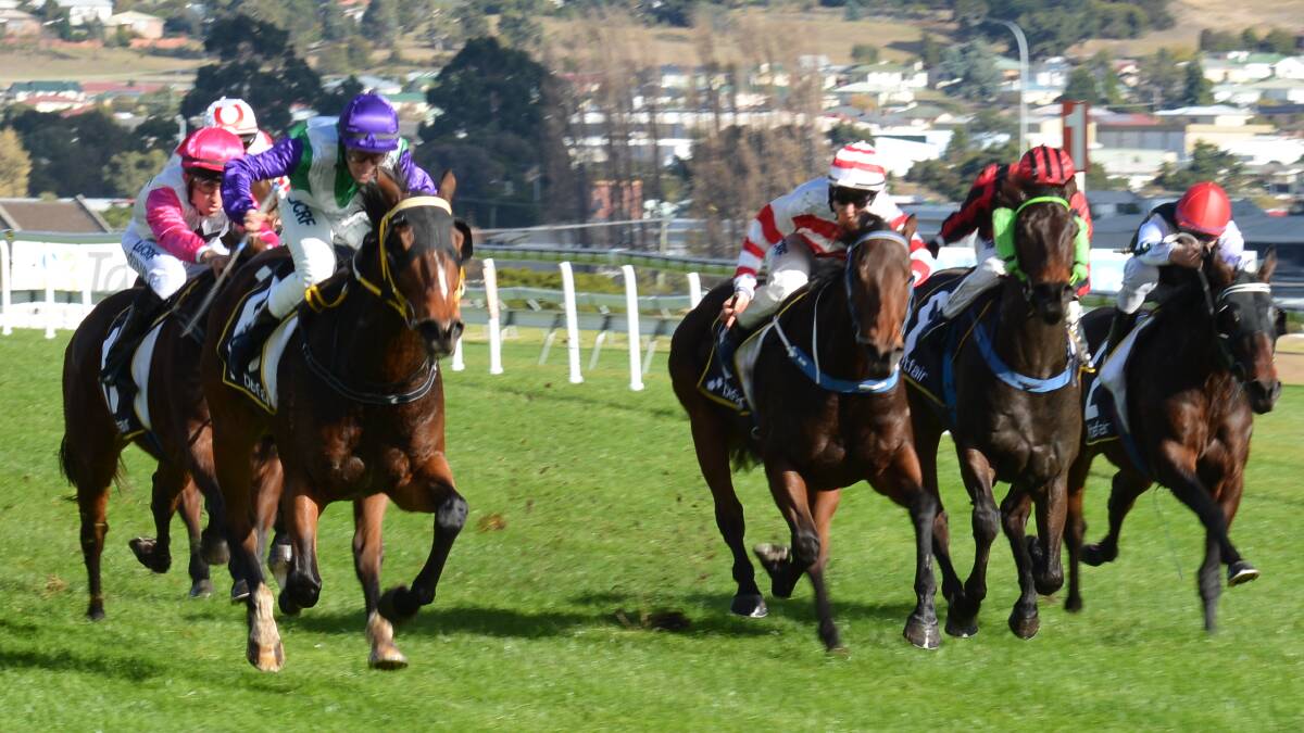 FINAL WIN: Larry Dalco won his last race as a trainer when Bachelor's Life (left), ridden by Sherry Barr, scored at Elwick on May 10 2015. Dalco died last week aged 77. 