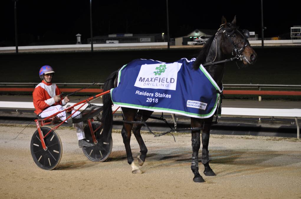 Harjeet with trainer-driver Todd Rattray after winning the Raider Stakes at Devonport in May