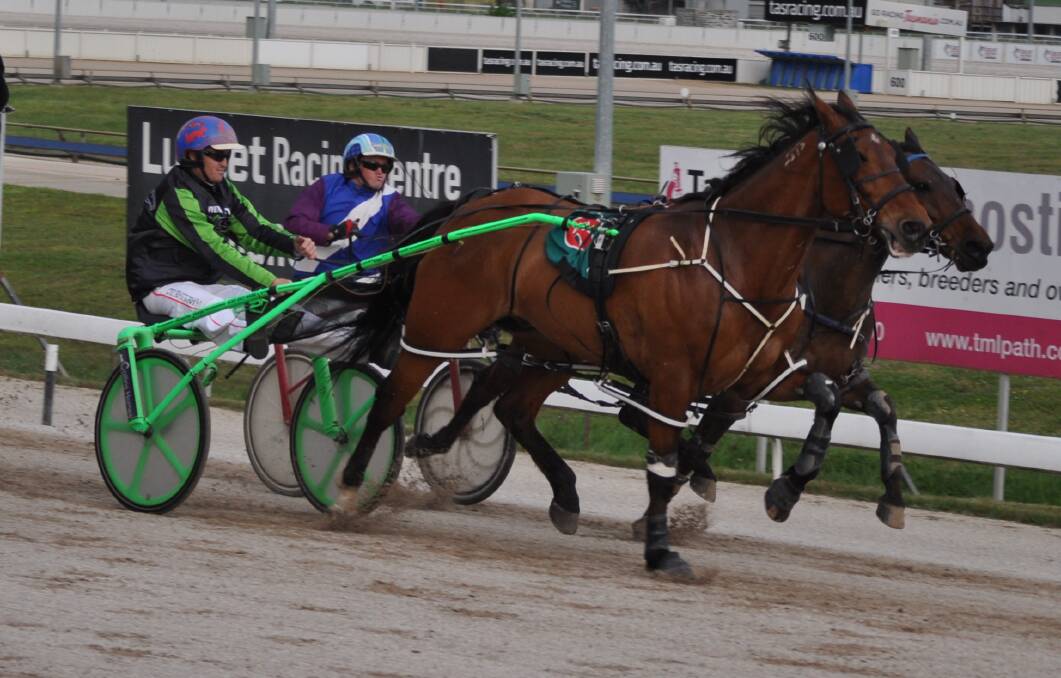 SPEEDING AHEAD: Full Speed Ahead, driven by Todd Rattray, beats Another Swinger (Gareth Rattray) in the Show Cup at Mowbray on Friday night. Picture: Greg Mansfield