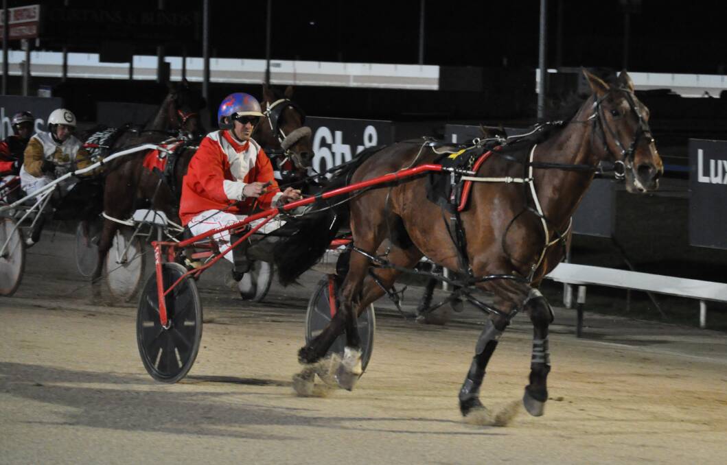 BACK TO BEST: Heavily-backed favourite Taurisi, driven by Todd Rattray, storms home to win the main race at Mowbray on Wednesday night. Picture: Greg Mansfield