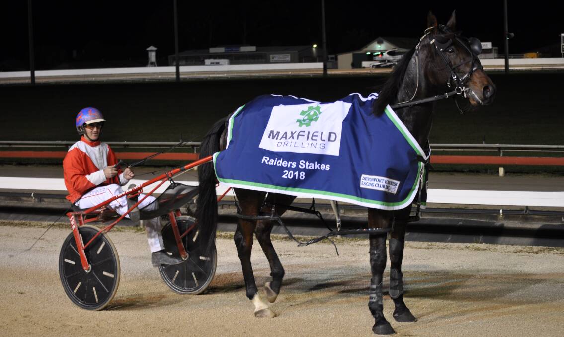 CLASS ABOVE: Harjeet and trainer-driver Todd Rattray pose for the cameras after an effortless win in the $40,000 Raider Stakes in Devonport on Friday night. Picture: Greg Mansfield