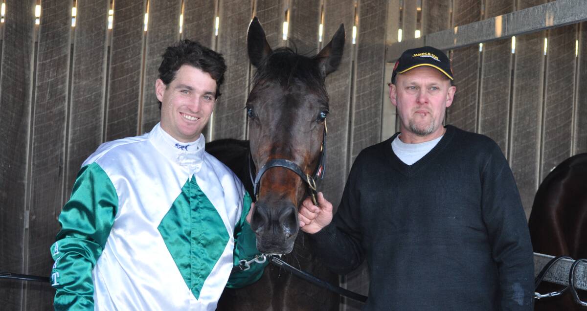 TIZ A WINNER: Driver Todd Rattray and trainer Wes Targett with Tiz A Shaker who won the first race of the new Devonport season on Friday night. Picture: Greg Mansfield