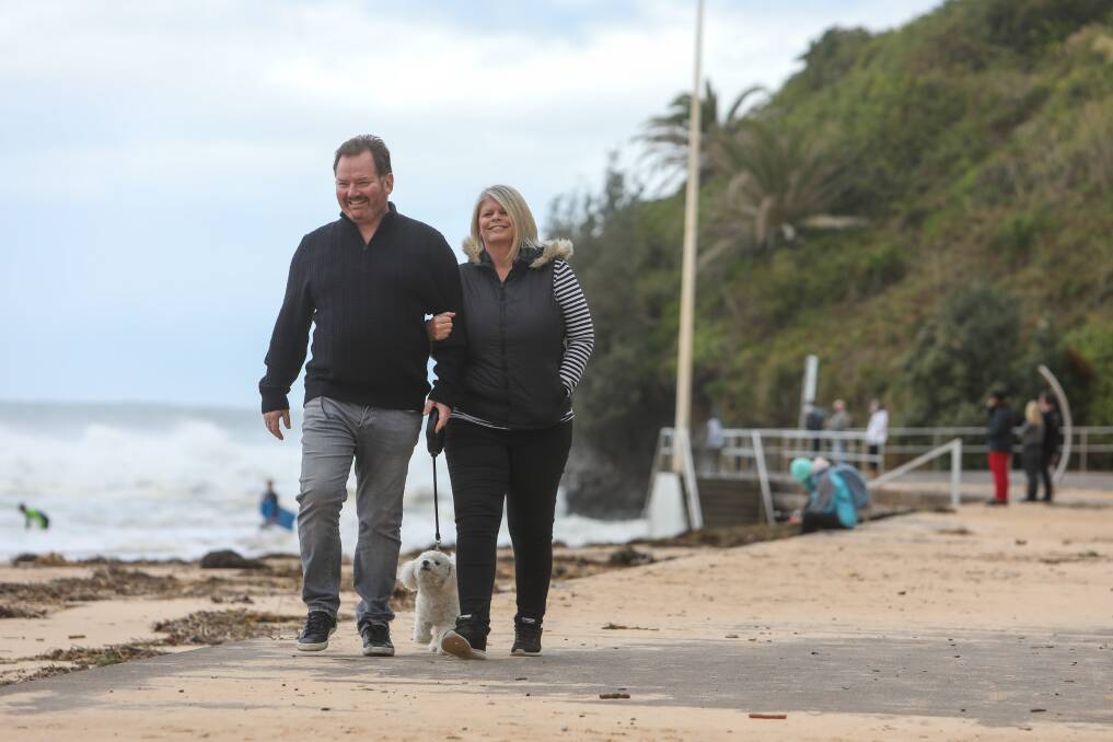 Jason and Leanne Chapman with dog Mimi at Austinmer Beach. Picture: Adam McLean