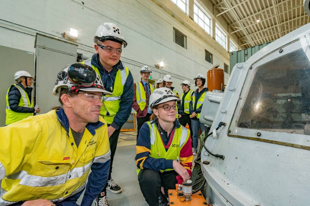 Trevallyn Power Station operator Michael Bell with Queechy High School student Jake Leslie and Riverside High School student Kara Smith during a tour. Picture: Phillip Biggs