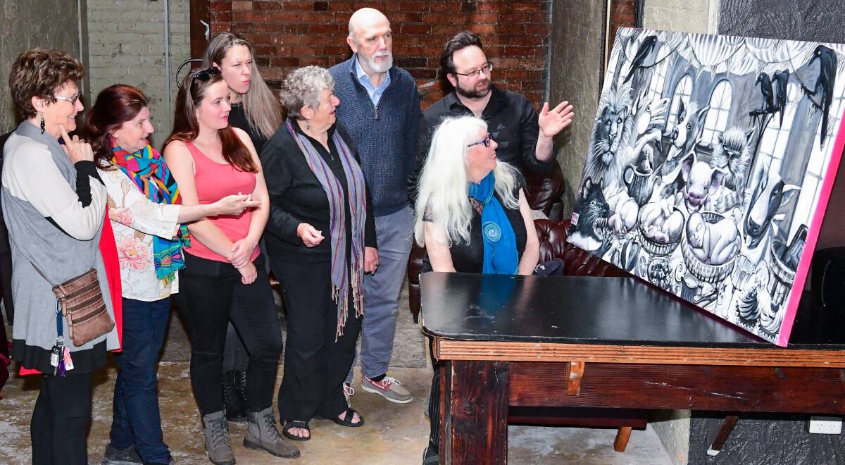 Poetry Festival: Marilyn Arnold, Yvonne Gluyas, Rebecca Young, Louise Arnold, Joy Elizabeth, Colin Berry, Chris Rattray, and Evie Wood admire Catriona MacLaine's work. Picture: Neil Richardson. 
