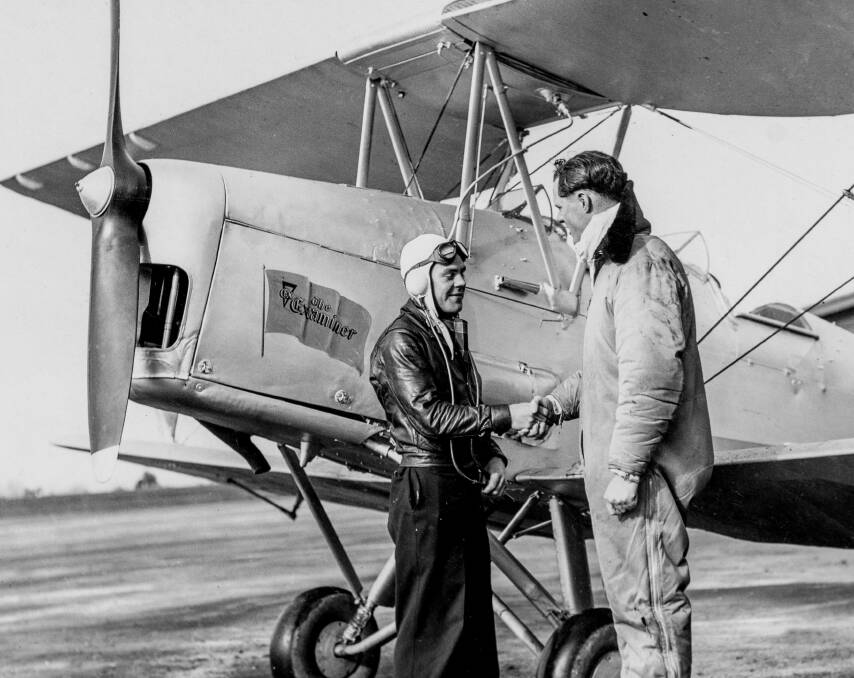 Neil Beattie with T.E. Davies near Tiger Moth. Picture copied by Phillip Biggs. 