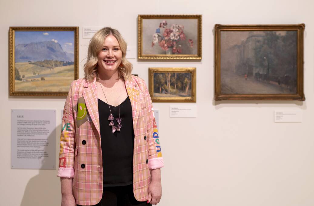 QVMAG senior curator of visual arts and design Ashleigh Whatling with Tom Roberts' paintings at Royal Park. Picture: Rob Burnett 